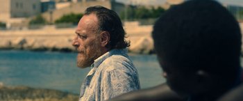 Movie still from “The Life Ahead” (2020), directed by Edoardo Ponti – A person with a beard; Close Up shot, Over the shoulder angle