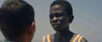 Movie still from “The Life Ahead” (2020), directed by Edoardo Ponti – Two young men are talking to each other; Close Up shot, Over the shoulder angle