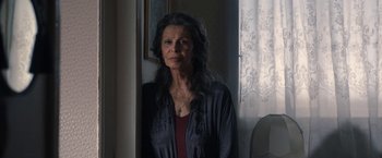 Movie still from “The Life Ahead” (2020), directed by Edoardo Ponti – An older woman standing in front of a mirror; Close Up shot, Over the shoulder angle