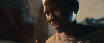 Movie still from “The Life Ahead” (2020), directed by Edoardo Ponti – A person with a smile on their face; Close Up shot, Over the shoulder angle