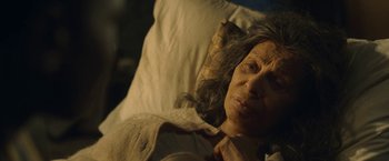 Movie still from “The Life Ahead” (2020), directed by Edoardo Ponti – An older woman laying in a bed with her eyes closed; Close Up shot, High angle