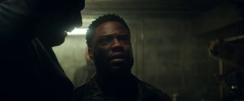 Movie still from “The Man from Toronto” (2022), directed by Patrick Hughes – A person with a beard; Close Up shot, Over the shoulder angle