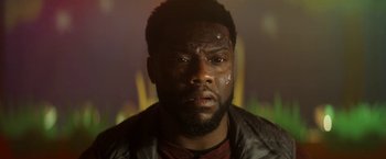 Movie still from “The Man from Toronto” (2022), directed by Patrick Hughes – A person wearing a jacket; Close Up shot, High angle