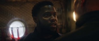 Movie still from “The Man from Toronto” (2022), directed by Patrick Hughes – A person looking at something; Close Up shot, Low angle