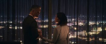 Movie still from “The Man from Toronto” (2022), directed by Patrick Hughes – A man and a woman holding each other's hands; Medium shot, Over the shoulder angle