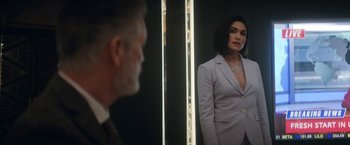 Movie still from “The Man from Toronto” (2022), directed by Patrick Hughes – A man and a woman looking at each other in a mirror; Medium shot, Over the shoulder angle