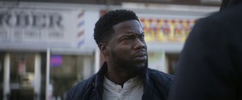 Movie still from “The Man from Toronto” (2022), directed by Patrick Hughes – A person with a beard; Close Up shot, Over the shoulder angle