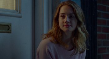 Movie still from “The Meyerowitz Stories” (2017), directed by Noah Baumbach – A woman with long blonde hair wearing a pink shirt; Close Up shot, Over the shoulder angle