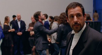 Movie still from “The Meyerowitz Stories” (2017), directed by Noah Baumbach – A group of people standing in a room; Close Up shot, Over the shoulder angle