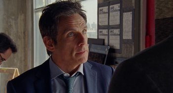 Movie still from “The Meyerowitz Stories” (2017), directed by Noah Baumbach – A man in a blue suit and a green neck tie; Close Up shot, Over the shoulder angle