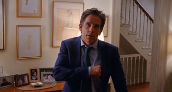 Movie still from “The Meyerowitz Stories” (2017), directed by Noah Baumbach – Ben stiller in a suit and tie in a room; Medium shot, Over the shoulder angle