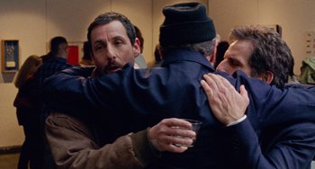 Movie still from “The Meyerowitz Stories” (2017), directed by Noah Baumbach – A group of people hugging each other in a room; Medium shot, Over the shoulder angle