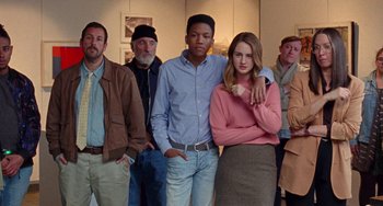 Movie still from “The Meyerowitz Stories” (2017), directed by Noah Baumbach – A group of people standing next to each other in a room; Medium shot, Low angle