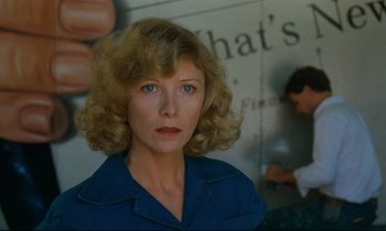 Movie still from “Paris, Texas” (1984), directed by Wim Wenders – A person wearing a blue shirt; Close Up shot, Over the shoulder angle