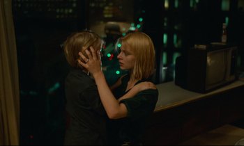 Movie still from “Paris, Texas” (1984), directed by Wim Wenders – A woman and a child touching each other's hair; Medium shot, Over the shoulder angle