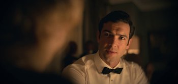 Movie still from “The Midnight Sky” (2020), directed by George Clooney – A man wearing a white shirt and a black bow tie; Close Up shot, Over the shoulder angle