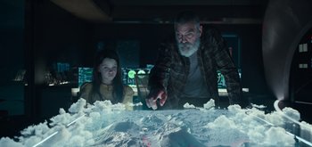 Movie still from “The Midnight Sky” (2020), directed by George Clooney – An older man and a young girl looking at a display; Medium shot, Low angle