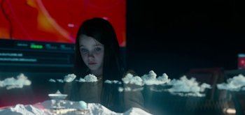 Movie still from “The Midnight Sky” (2020), directed by George Clooney – A young girl sitting in front of a screen; Close Up shot, Low angle