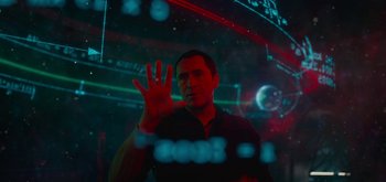Movie still from “The Midnight Sky” (2020), directed by George Clooney – A man is holding his hand up in front of a window; Medium shot, Low angle