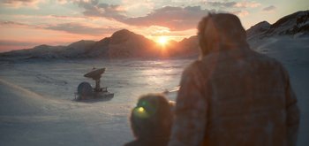 Movie still from “The Midnight Sky” (2020), directed by George Clooney – Two people on a boat in the middle of the ocean; Extreme Wide shot, Over the shoulder angle