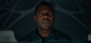 Movie still from “The Midnight Sky” (2020), directed by George Clooney – A person with his eyes wide open; Close Up shot, Low angle