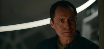 Movie still from “The Midnight Sky” (2020), directed by George Clooney – A person looking at the camera; Close Up shot, Low angle