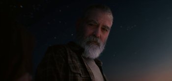 Movie still from “The Midnight Sky” (2020), directed by George Clooney – An old man with a beard and a plaid shirt; Close Up shot, Low angle