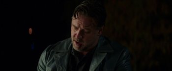 Movie still from “The Nice Guys” (2016), directed by Shane Black – A person wearing a leather jacket; Close Up shot, Over the shoulder angle