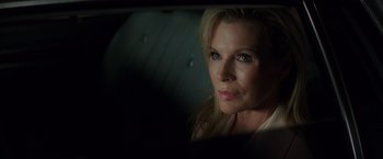 Movie still from “The Nice Guys” (2016), directed by Shane Black – A person sitting in a car; Close Up shot, Over the shoulder angle