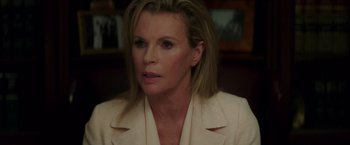 Movie still from “The Nice Guys” (2016), directed by Shane Black – A person wearing a jacket; Close Up shot, Over the shoulder angle