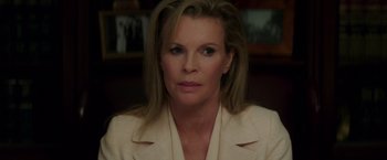 Movie still from “The Nice Guys” (2016), directed by Shane Black – A person wearing a jacket; Close Up shot, Over the shoulder angle