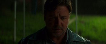 Movie still from “The Nice Guys” (2016), directed by Shane Black – A person wearing a jacket; Close Up shot, Over the shoulder angle