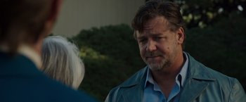 Movie still from “The Nice Guys” (2016), directed by Shane Black – A person wearing a blue shirt; Close Up shot, Over the shoulder angle