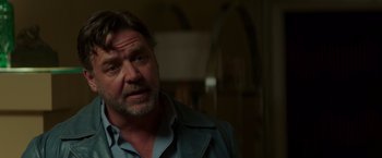 Movie still from “The Nice Guys” (2016), directed by Shane Black – A person wearing a jacket; Close Up shot, Over the shoulder angle