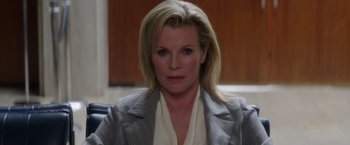 Movie still from “The Nice Guys” (2016), directed by Shane Black – A woman with blonde hair wearing a gray jacket; Close Up shot, Low angle