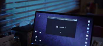 Movie still from “The Night Agent” (2023), created by Shawn Ryan – A computer screen with a computer on it's desktop; Close Up shot, Over the shoulder angle