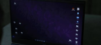 Movie still from “The Night Agent” (2023), created by Shawn Ryan – A computer monitor with a dark background; Extreme Close Up shot, High angle