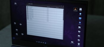 Movie still from “The Night Agent” (2023), created by Shawn Ryan – A computer screen with a computer screen showing a computer; Extreme Close Up shot, High angle