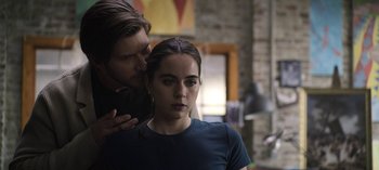 Movie still from “The Night Agent” (2023), created by Shawn Ryan – A man and a woman standing next to each other; Close Up shot, Over the shoulder angle