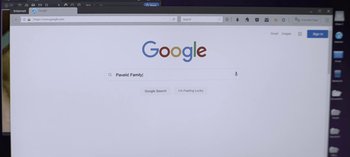 Movie still from “The Night Agent” (2023), created by Shawn Ryan – A computer screen showing the google search page; Extreme Close Up shot, Over the shoulder angle