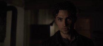 Movie still from “The Night Agent” (2023), created by Shawn Ryan – A person wearing a black jacket; Close Up shot, Over the shoulder angle