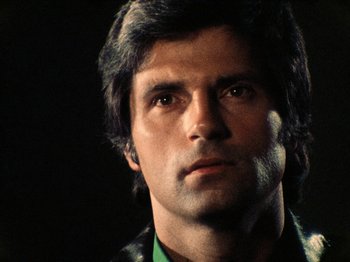 Movie still from “The Other Side of the Wind” (2018), directed by Orson Welles – A person wearing a green shirt; Close Up shot, Low angle