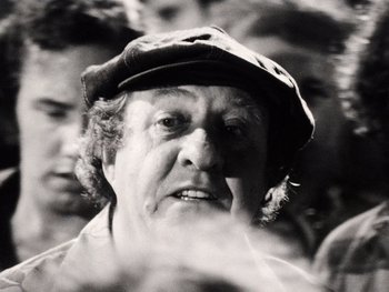 Movie still from “The Other Side of the Wind” (2018), directed by Orson Welles – An old man wearing a hat and looking at the camera; Close Up shot, Low angle