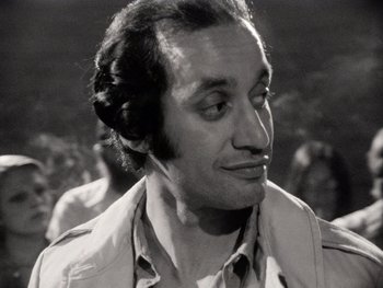 Movie still from “The Other Side of the Wind” (2018), directed by Orson Welles – An old black and white photo of a man looking to his left; Close Up shot, Low angle