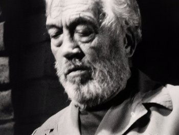 Movie still from “The Other Side of the Wind” (2018), directed by Orson Welles – An older man with a beard and a mustache; Close Up shot, Low angle