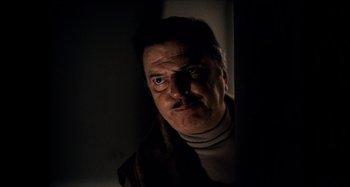 Movie still from “The Other Side of the Wind” (2018), directed by Orson Welles – A person wearing a jacket; Close Up shot, Low angle