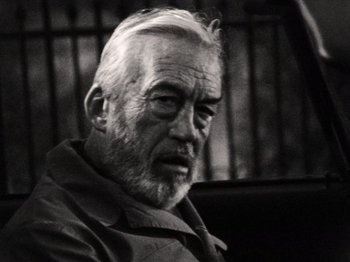 Movie still from “The Other Side of the Wind” (2018), directed by Orson Welles – An older man with a beard and a mustache; Close Up shot, Low angle