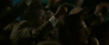 Movie still from “The Outsider” (2018), directed by Martin Zandvliet – An older man wearing a hat and glasses; Close Up shot, Low angle