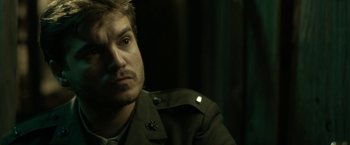 Movie still from “The Outsider” (2018), directed by Martin Zandvliet – A person wearing a uniform; Close Up shot, Over the shoulder angle