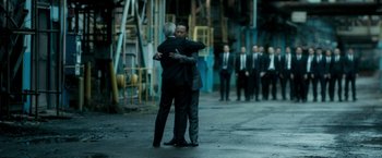 Movie still from “The Outsider” (2018), directed by Martin Zandvliet – A couple of people that are hugging each other; Wide shot, Over the shoulder angle